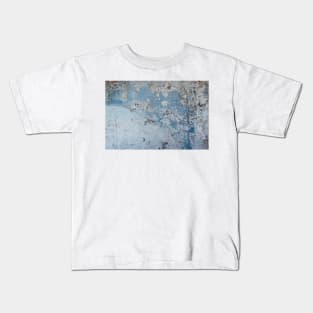 Wall distressed. Old blue wall texture background. Wall texture Kids T-Shirt